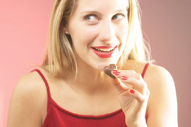 Woman eating chocolate